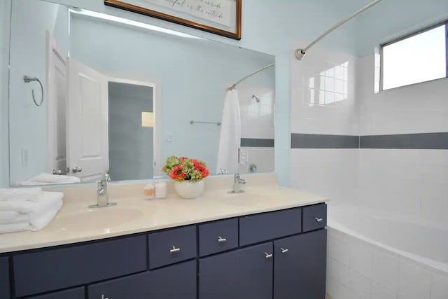 bathroom featuring double vanity and a sink