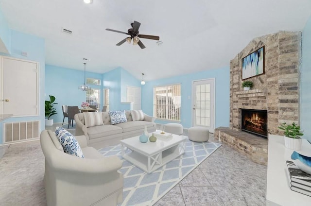 13523 Bonilla Ln, Houston, TX 77083 - living area with lofted ceiling, ceiling fan, a fireplace, and tile patterned floors