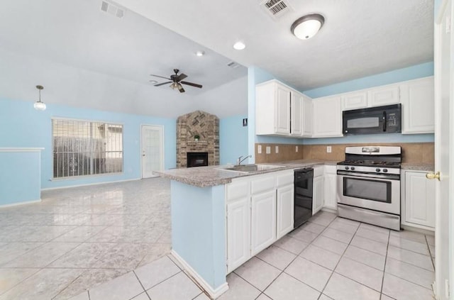 13523 Bonilla Ln, Houston, TX 77083 - kitchen with black appliances, a sink, vaulted ceiling, light tile patterned floors, and light countertops
