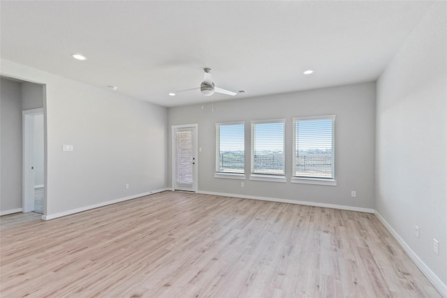 spare room with recessed lighting, baseboards, light wood finished floors, and ceiling fan