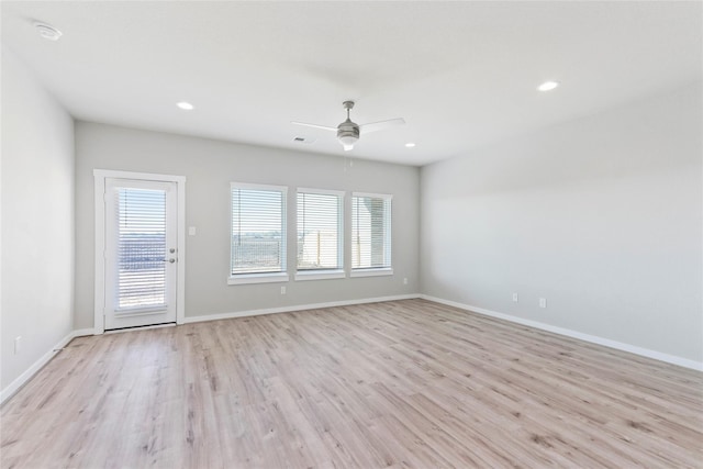 unfurnished living room with baseboards, ceiling fan, visible vents, and light wood finished floors