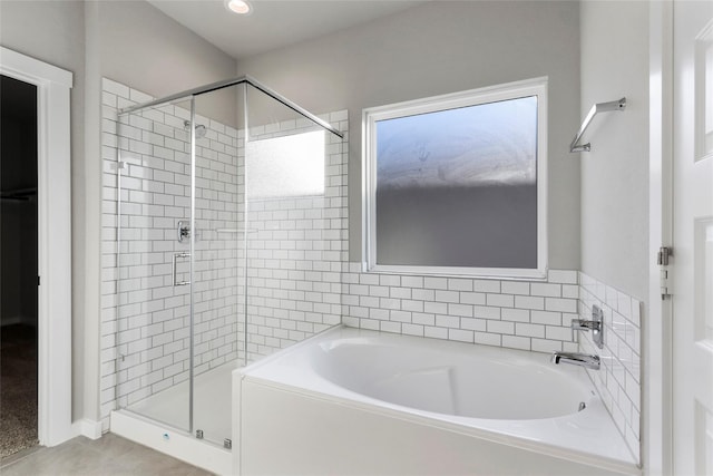 full bath featuring recessed lighting, a garden tub, and a shower stall