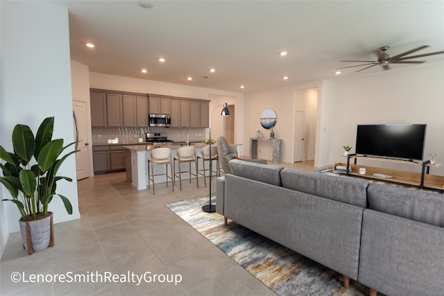 3708 Rock Ledge Dr, Rosenberg, TX 77469 - living area featuring light tile patterned floors, recessed lighting, and ceiling fan
