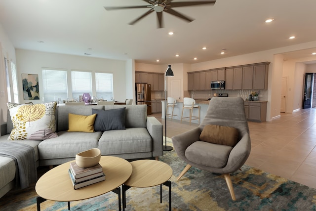 3708 Rock Ledge Dr, Rosenberg, TX 77469 - living area with a ceiling fan, recessed lighting, and light tile patterned floors