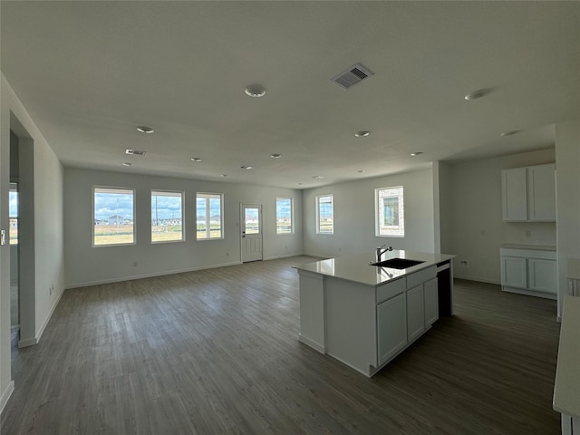 9318 Vendace Dr, Baytown, TX 77521 - kitchen featuring a sink, baseboards, wood finished floors, and recessed lighting