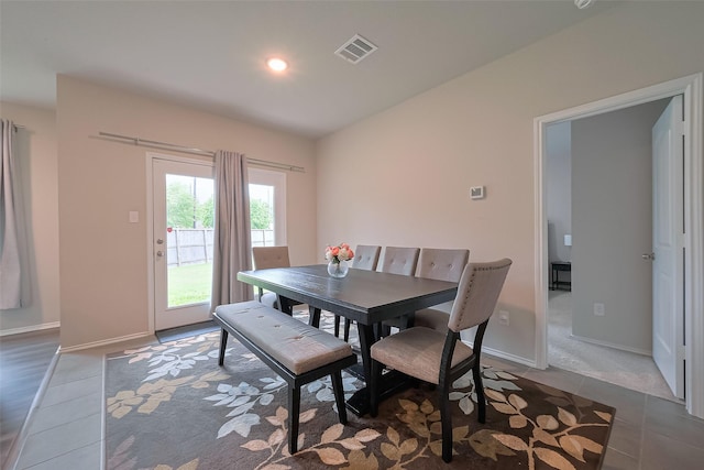 tiled dining space featuring baseboards, visible vents, and recessed lighting