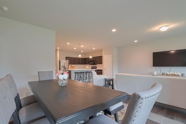 dining space featuring recessed lighting