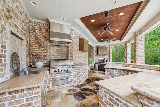 view of patio / terrace featuring a sink, an outdoor fireplace, a ceiling fan, an outdoor kitchen, and grilling area