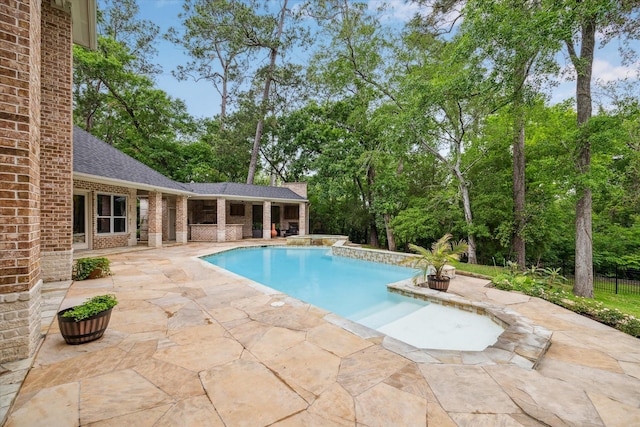 outdoor pool featuring a patio