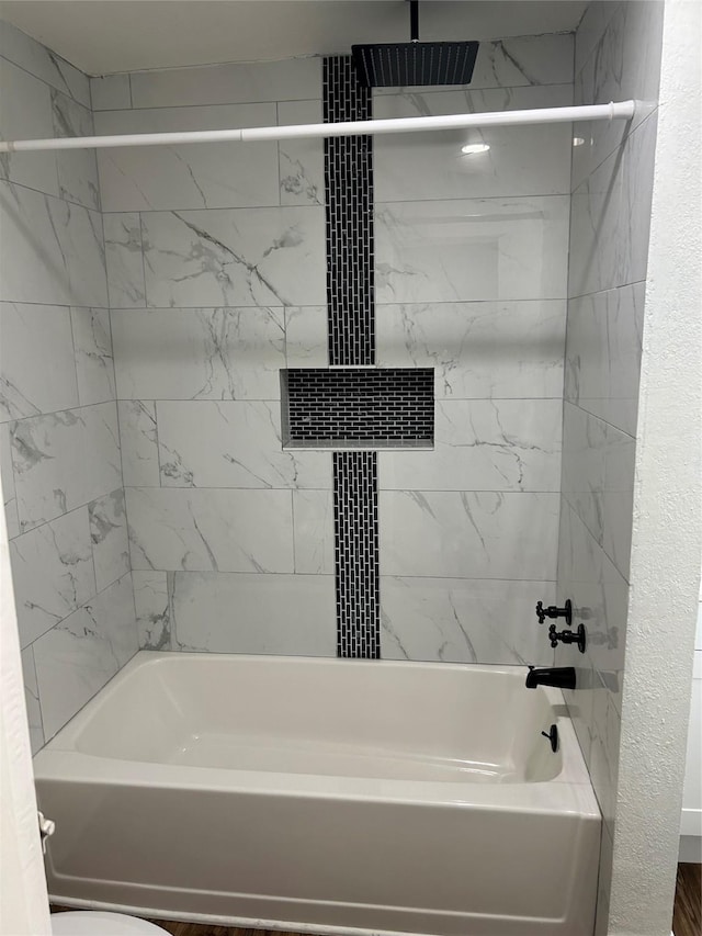 304 Tanner Ave, Cleveland, TX 77327 - bathroom featuring a combined bath / shower with rainfall shower