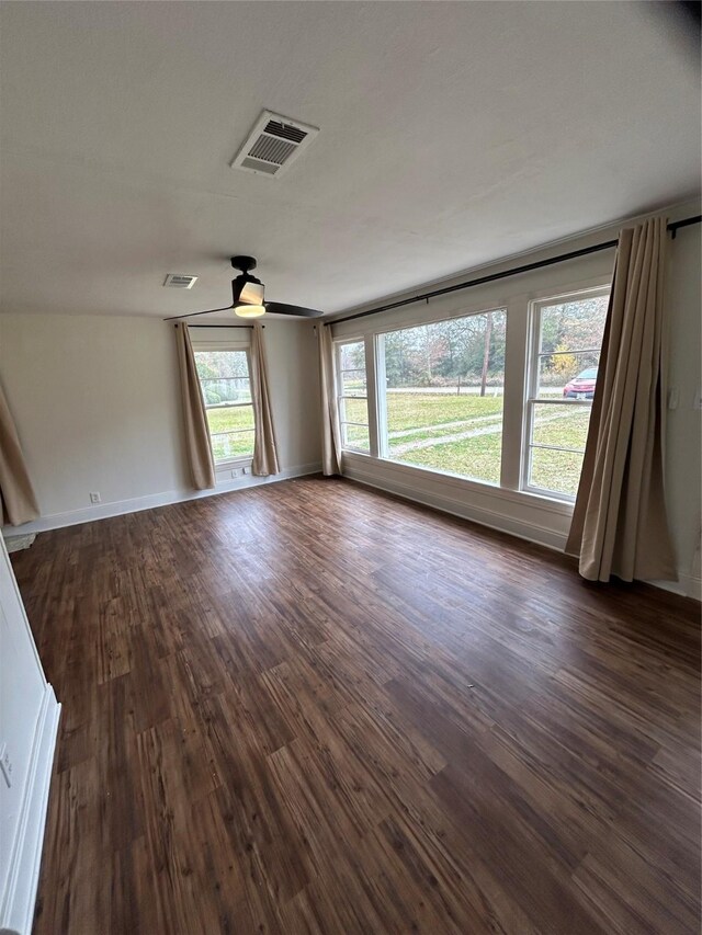 304 Tanner Ave, Cleveland, TX 77327 - empty room featuring dark wood-type flooring, a ceiling fan, and baseboards