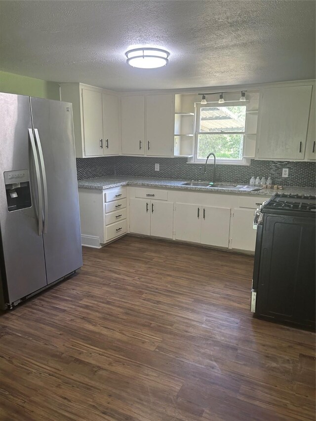 304 Tanner Ave, Cleveland, TX 77327 - kitchen featuring stainless steel fridge with ice dispenser, a sink, open shelves, tasteful backsplash, and a textured ceiling