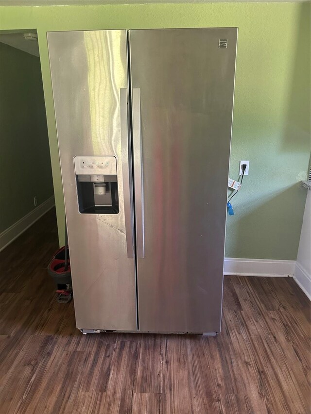 304 Tanner Ave, Cleveland, TX 77327 - kitchen view of stainless steel fridge with ice dispenser, baseboards, and wood finished floors