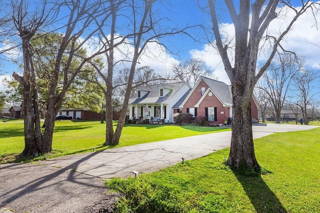 315 County Road 893, Angleton, TX 77515 - view of front of house with a front lawn and driveway