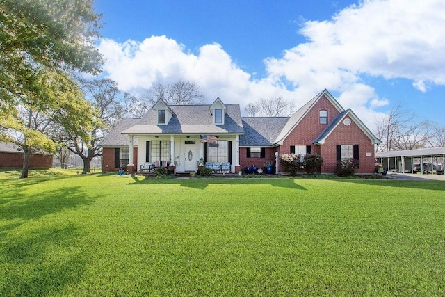 315 County Road 893, Angleton, TX 77515 - cape cod house with a front lawn, a porch, and brick siding