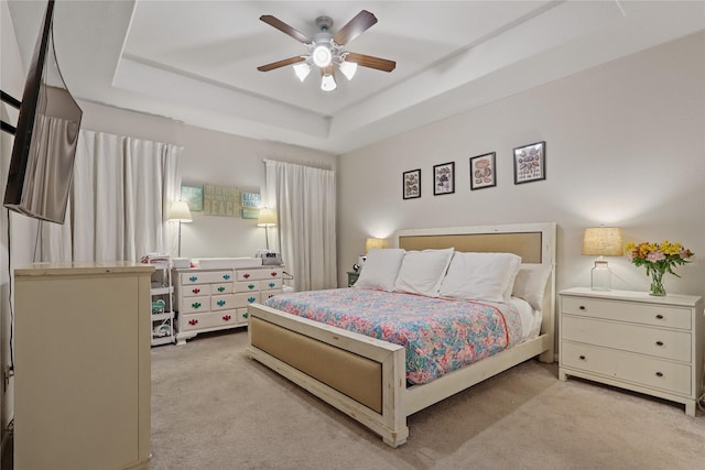 2225 Windy Sail Dr, Texas City, TX 77568 - carpeted bedroom featuring a tray ceiling and ceiling fan