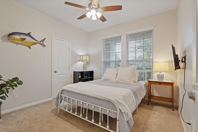 2225 Windy Sail Dr, Texas City, TX 77568 - bedroom with baseboards, ceiling fan, and light colored carpet