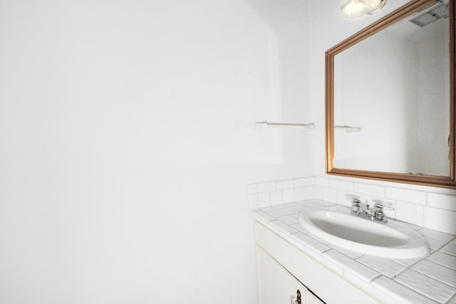 9654 Westview Dr Unit 9, Houston, TX 77055 - bathroom featuring decorative backsplash and vanity
