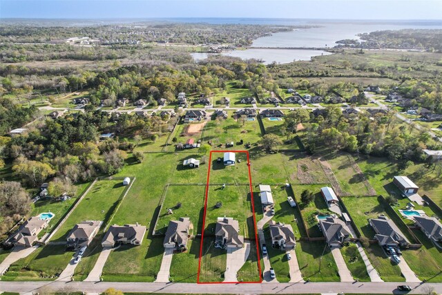 13295 Hidden Trail Ct, Willis, TX 77318 - aerial view of residential area with a nearby body of water and property boundaries highlighted