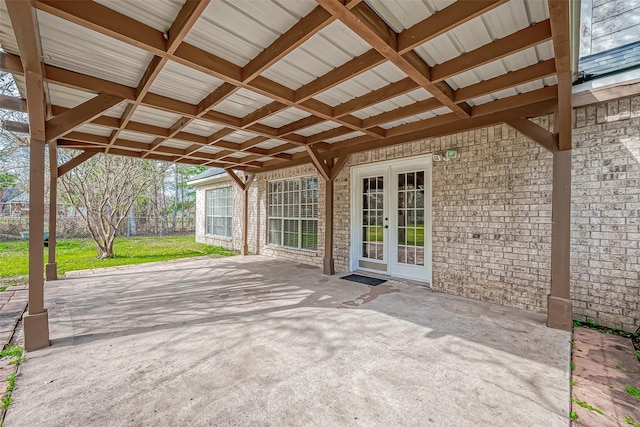 view of patio featuring fence and french doors