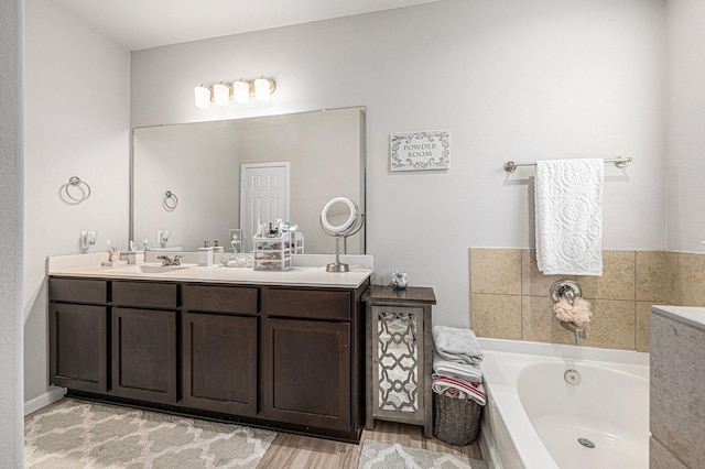 408 Long Beach Bay Dr, Katy, TX 77493 - bathroom with a bath, double vanity, and wood finished floors