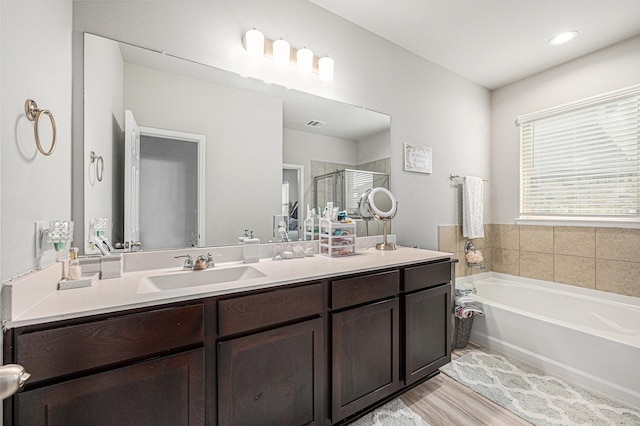408 Long Beach Bay Dr, Katy, TX 77493 - full bath featuring vanity, a bath, a shower stall, and wood finished floors