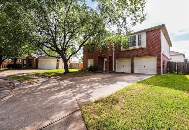 traditional home featuring fence, brick siding, concrete driveway, a garage, and a front yard