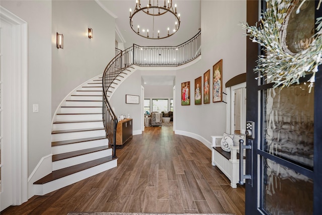 27415 Siandra Creek Ln, Spring, TX 77386 - entrance foyer with stairway, a chandelier, wood finished floors, a high ceiling, and baseboards