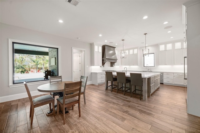 27415 Siandra Creek Ln, Spring, TX 77386 - dining room with light wood finished floors, recessed lighting, baseboards, and a chandelier