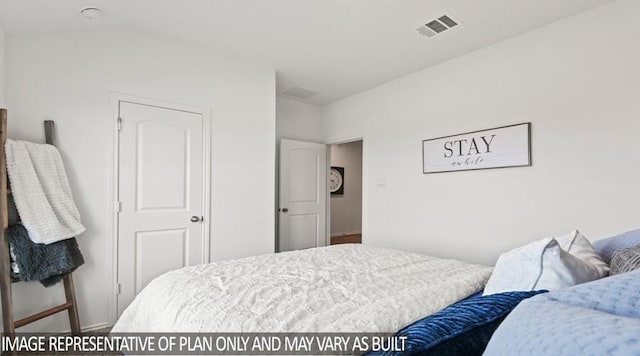 bedroom featuring visible vents and baseboards