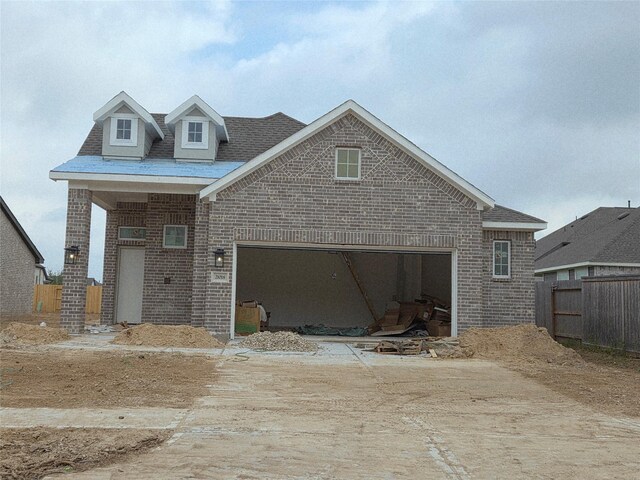 21018 Blue Breeze Dr, Cypress, TX 77433 - view of front of property with brick siding, dirt driveway, and an attached garage