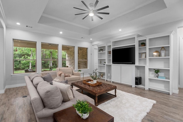 13130 Victoria Trce, Montgomery, TX 77316 - living room with recessed lighting, a ceiling fan, light wood-style flooring, and a raised ceiling
