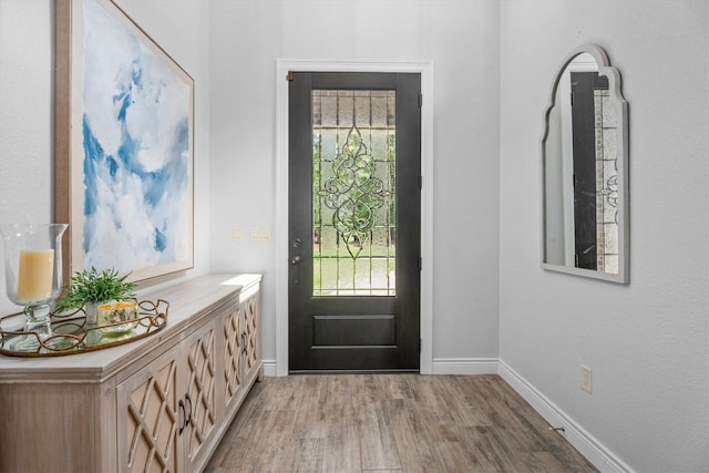 13130 Victoria Trce, Montgomery, TX 77316 - doorway with plenty of natural light, light wood-style flooring, and baseboards