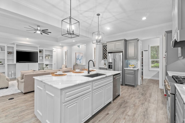 13130 Victoria Trce, Montgomery, TX 77316 - kitchen featuring a kitchen island with sink, a sink, recessed lighting, gray cabinets, and high quality appliances
