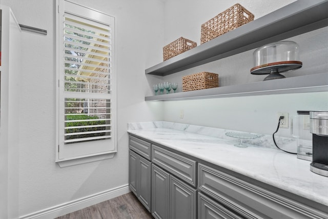 13130 Victoria Trce, Montgomery, TX 77316 - bar featuring baseboards, a healthy amount of sunlight, and wood finished floors