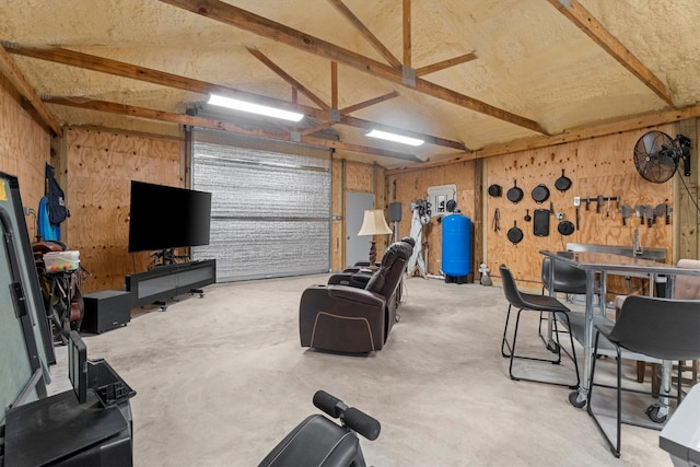 13130 Victoria Trce, Montgomery, TX 77316 - living room with a garage, concrete floors, and a workshop area