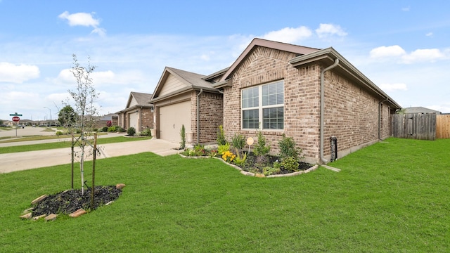 view of property exterior featuring brick siding, an attached garage, a yard, and driveway