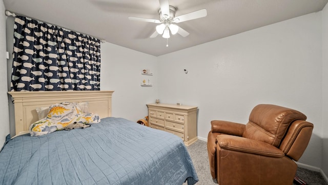 bedroom featuring carpet, baseboards, and a ceiling fan