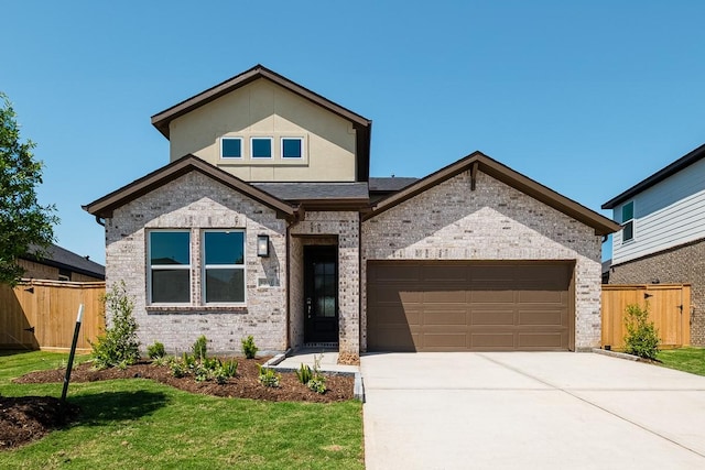 view of front of home with a garage, brick siding, concrete driveway, and fence