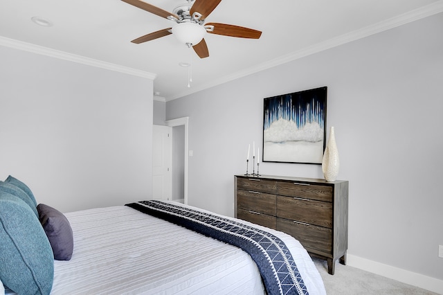 bedroom featuring baseboards, ornamental molding, a ceiling fan, and light colored carpet