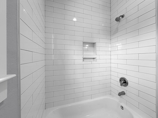bathroom with shower / bathing tub combination