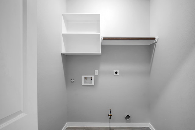 clothes washing area featuring laundry area, baseboards, hookup for a washing machine, gas dryer hookup, and electric dryer hookup
