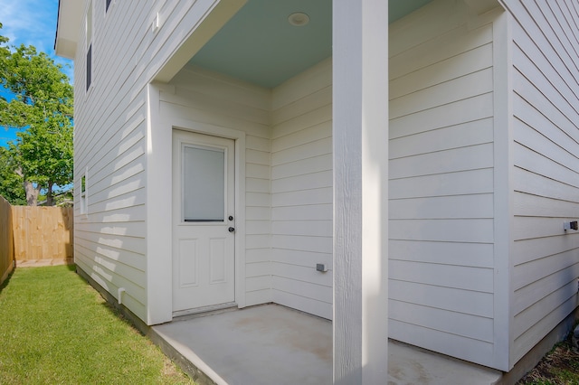 doorway to property with fence