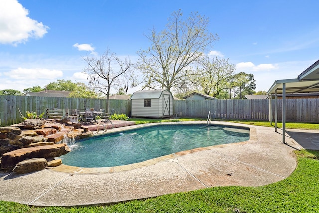 view of pool with a patio area, a fenced backyard, an outdoor structure, and a shed