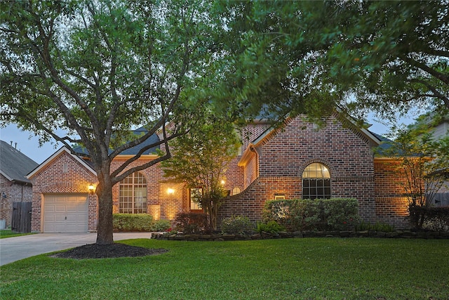 12203 Pinelands Park Ln, Humble, TX 77346 - traditional home featuring brick siding, concrete driveway, an attached garage, and a front yard