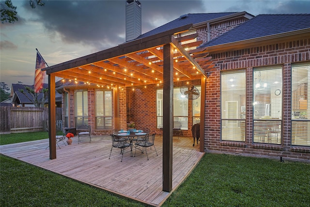 12203 Pinelands Park Ln, Humble, TX 77346 - deck at dusk featuring a pergola and outdoor dining space