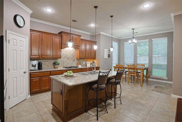 12203 Pinelands Park Ln, Humble, TX 77346 - kitchen with a sink, backsplash, brown cabinets, light tile patterned flooring, and ornamental molding