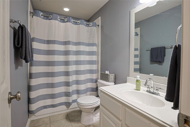 12203 Pinelands Park Ln, Humble, TX 77346 - bathroom with toilet, vanity, tile patterned floors, a shower with curtain, and a textured wall