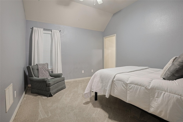 12203 Pinelands Park Ln, Humble, TX 77346 - carpeted bedroom with vaulted ceiling, baseboards, and a ceiling fan