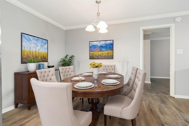 4119 Medical Dr Unit E104, San Antonio, TX 78229 - dining space with baseboards, ornamental molding, wood finished floors, and a notable chandelier